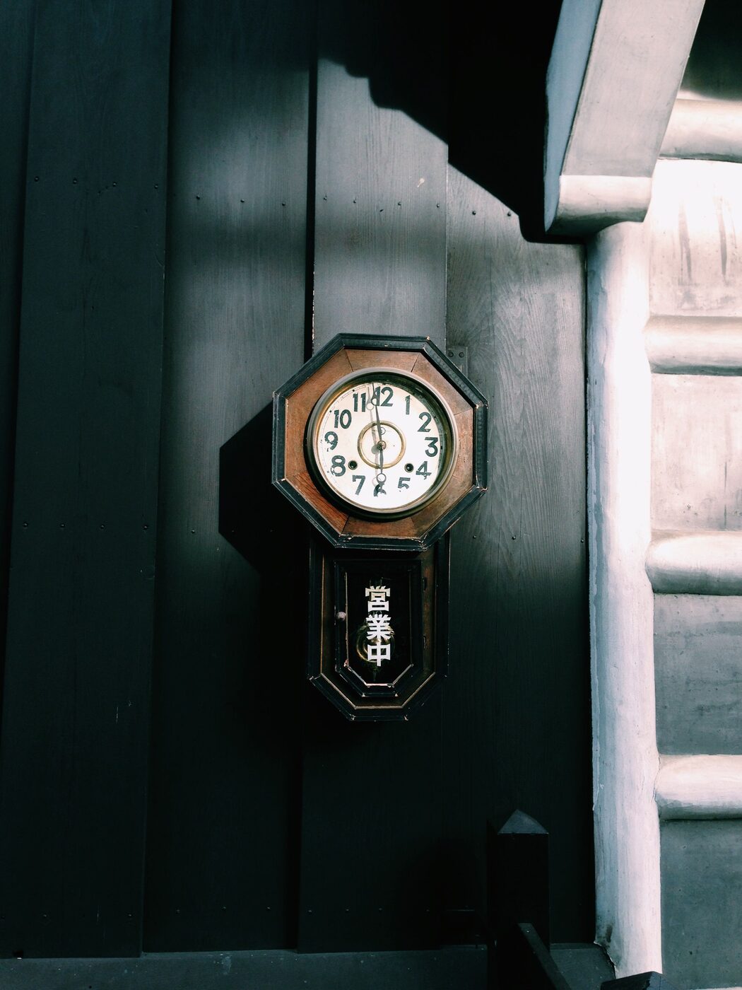 Japanese octagonal (hakkaku) wood-cased pendulum wall clock